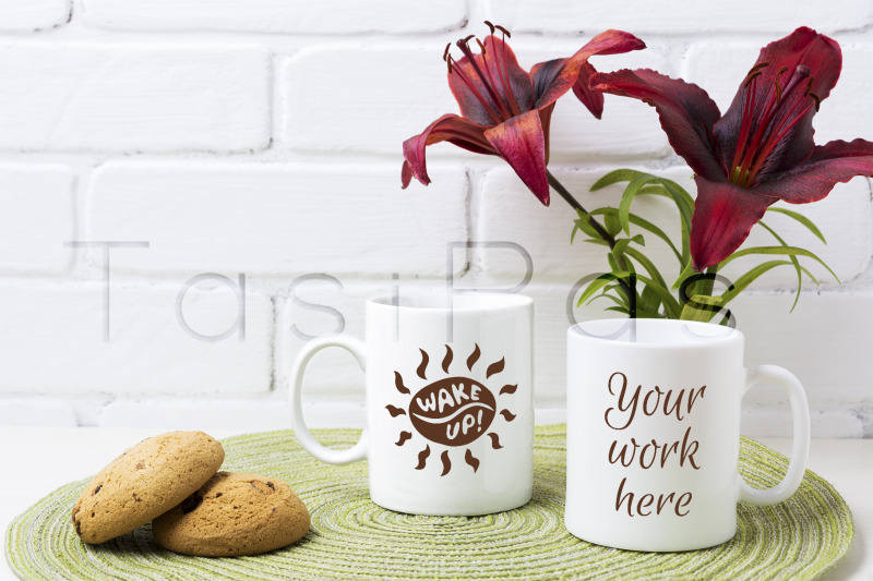two-coffee-mug-mockup-with-red-lily-and-cookie