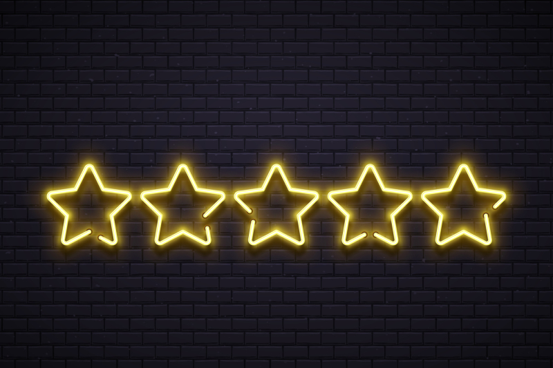 neon-five-stars-golden-illuminated-star-neons-lamps-on-brick-wall-go