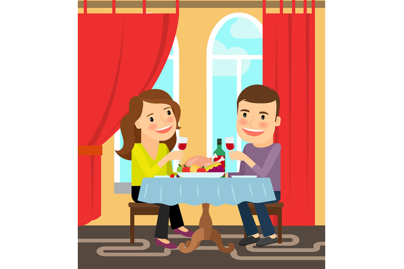 couple-sitting-at-table-celebrating