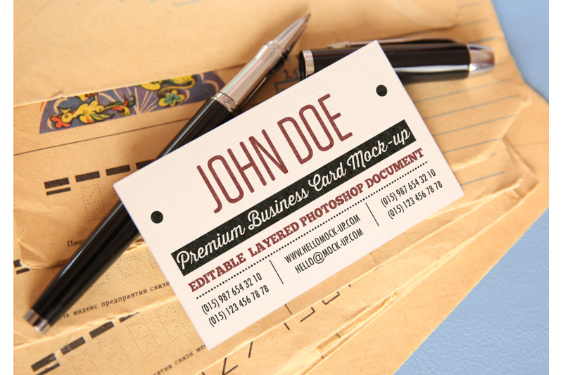 business-card-template-with-pens-and-old-antique-envelopes-background
