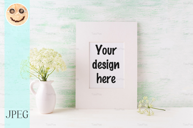 easy-white-frame-mockup-with-tender-wild-flowers-in-pitcher