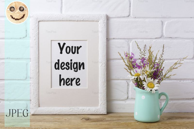 white-frame-mockup-with-chamomile-and-purple-field-flowers-in-mint-pi