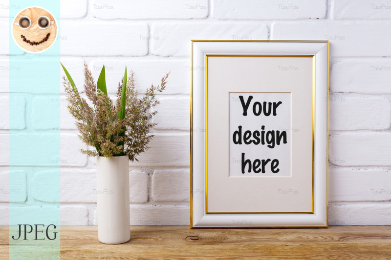 gold-decorated-frame-mockup-with-grass-and-green-leaves-in-cylinder-v