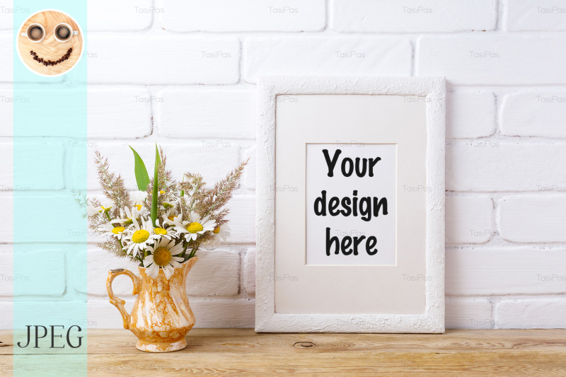 white-frame-mockup-with-chamomile-and-grass-in-golden-vase