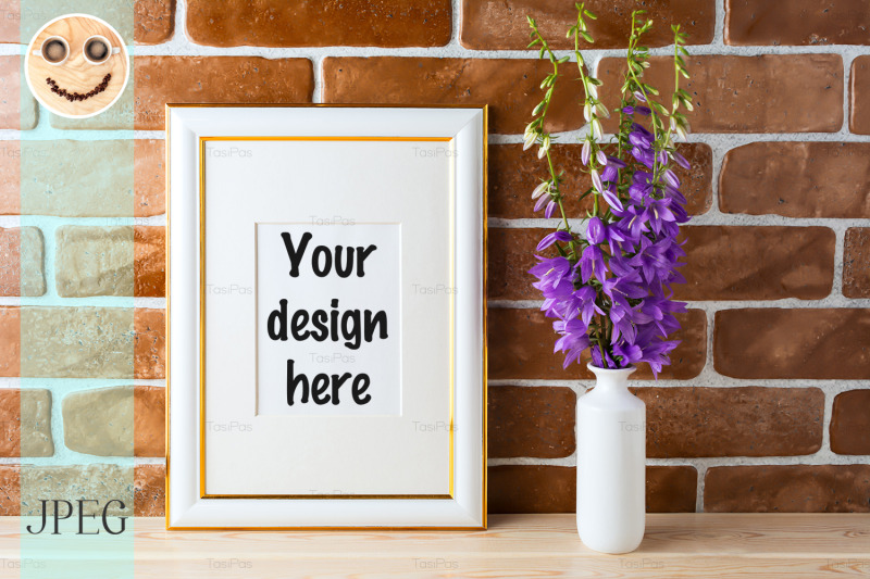 gold-decorated-frame-mockup-with-bellflower-bouquet-exposed-brick-wall