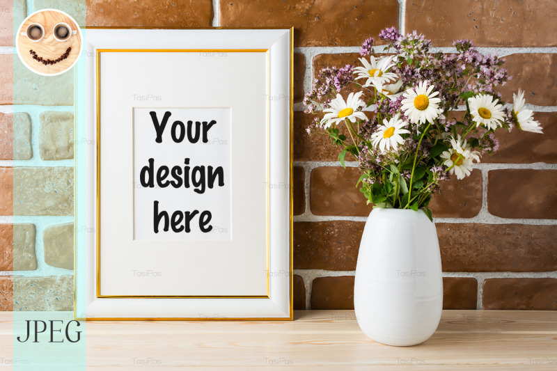 gold-decorated-frame-mockup-with-wildflowers-bouquet-exposed-brick-wal
