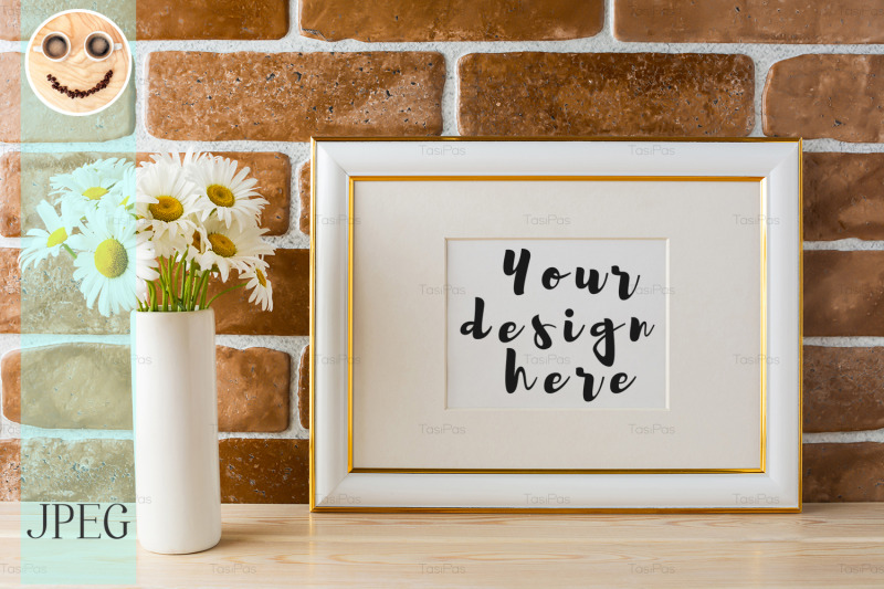 gold-decorated-landscape-frame-mockup-with-daisy-bouquet-in-vase