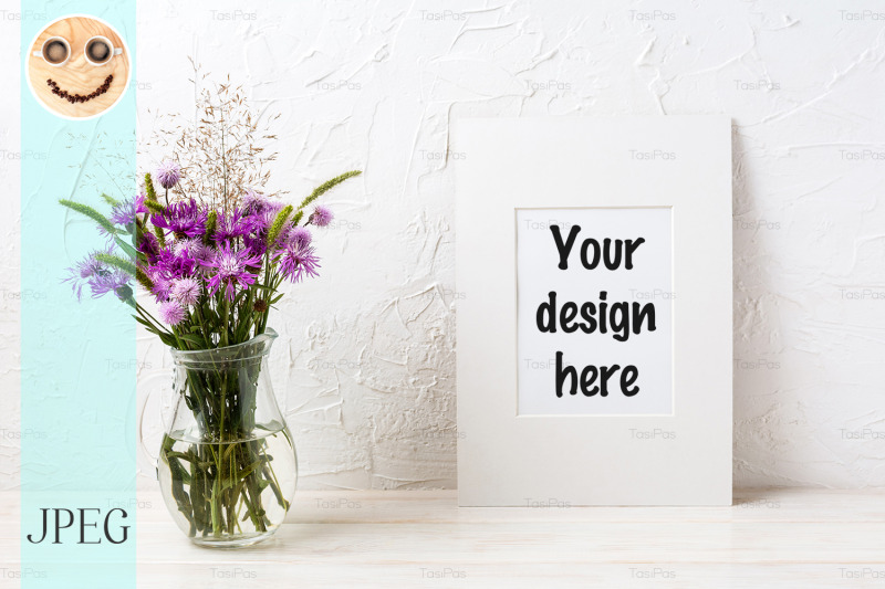 white-frame-mockup-with-purple-burdock-in-the-glass-jug