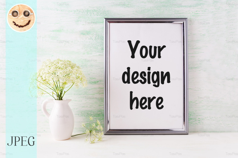 silver-frame-mockup-with-delicate-wild-field-flowers-in-pitcher
