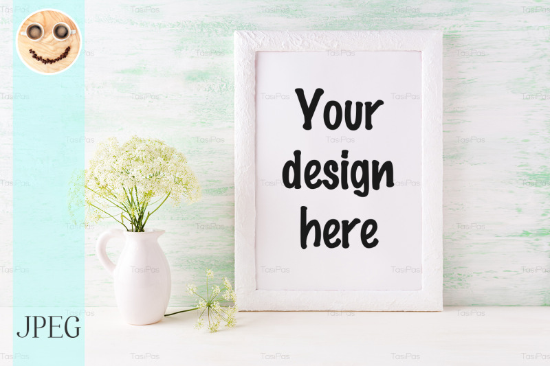 white-frame-mockup-with-delicate-wild-field-flowers-in-pitcher