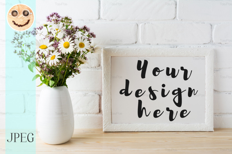 white-landscape-frame-mockup-with-blooming-wildflower-bouquet-in-vase