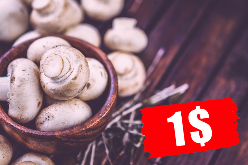 mushrooms-champignons-in-bowl-on-dark-wooden-background