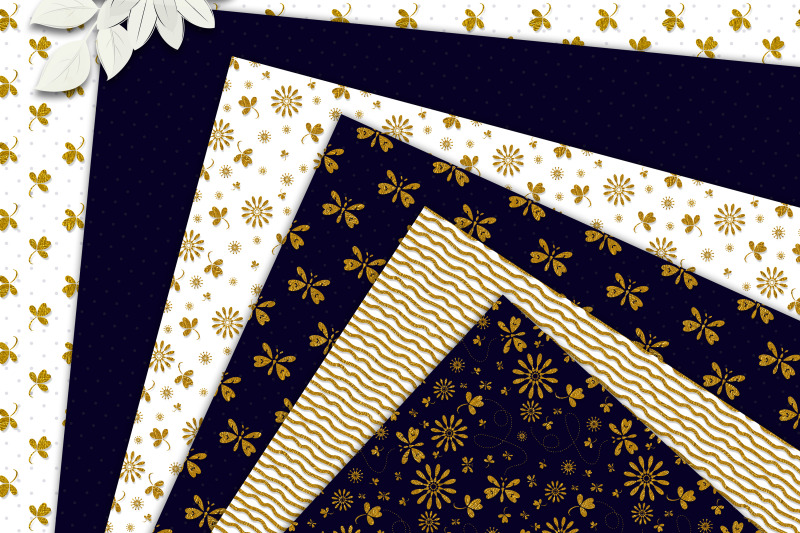 golden-patterns-on-royal-blue-and-white-scrapbook-paper
