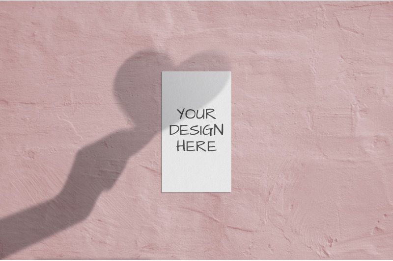 business-card-mockup-with-shadows-heart-in-hand-on-coral-background