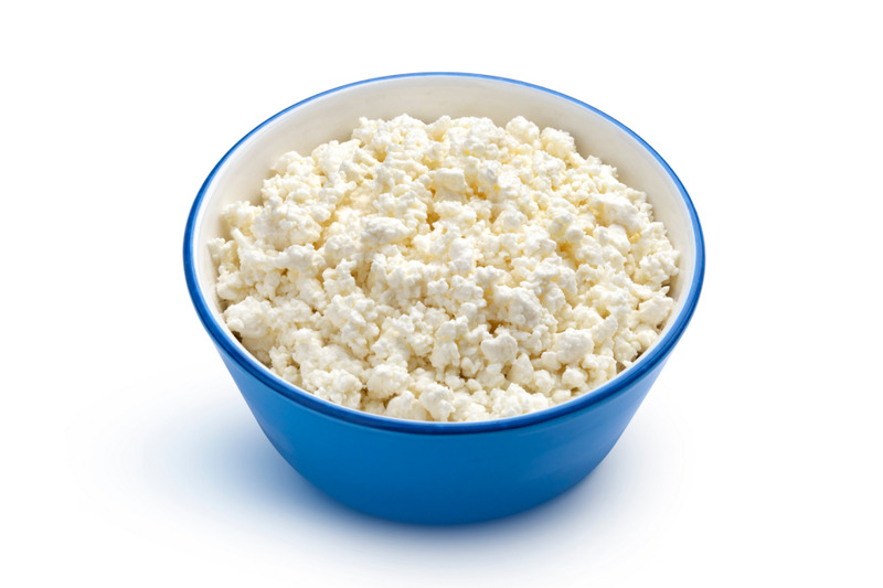 cottage-cheese-in-blue-bowl-isolated-on-white-background