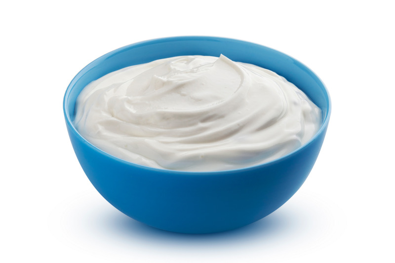 fresh-greek-yogurt-in-blue-bowl-isolated-on-white-background