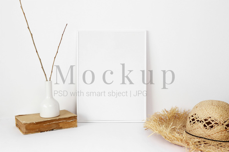 white-photo-frame-mockup-with-old-book