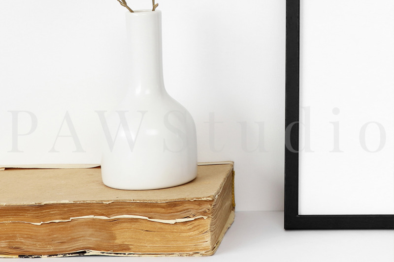 black-photo-frame-mockup-with-white-vase