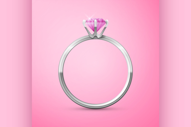 silver-wedding-ring-on-pink-background