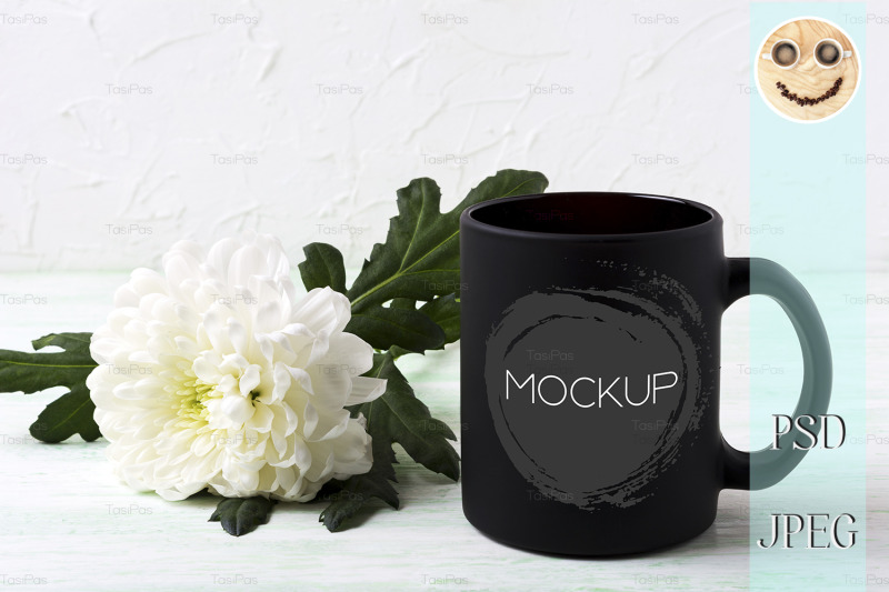black-coffee-mug-mockup-with-white-chrysanthemum