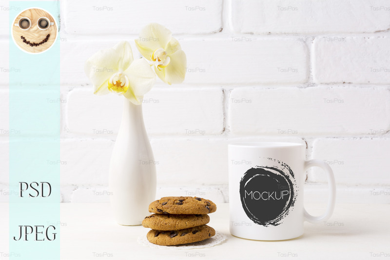 white-coffee-mug-mockup-with-soft-yellow-orchid-in-vase-and-cookies