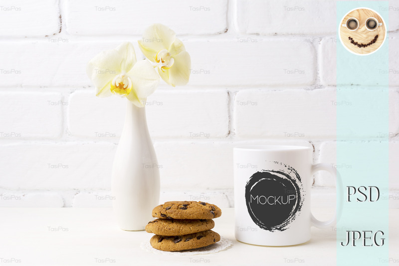 white-coffee-mug-mockup-with-soft-yellow-orchid-in-vase-and-cookies