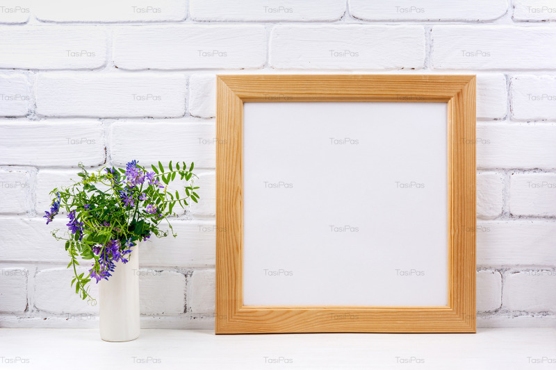 square-wooden-picture-frame-mockup-with-bird-vetch