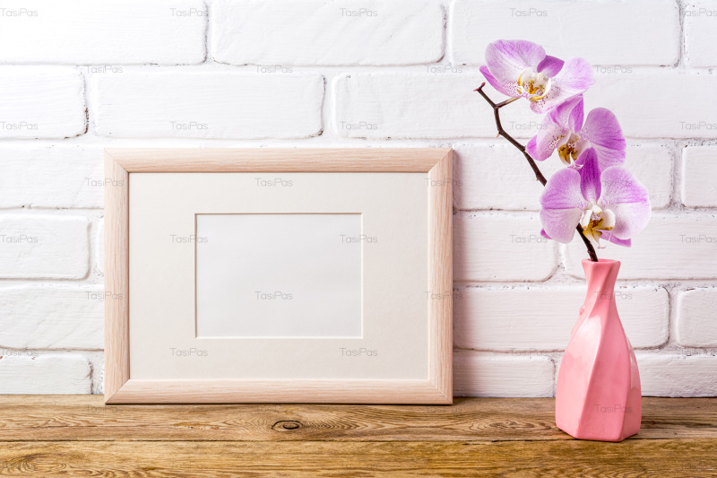 wooden-landscape-frame-mockup-with-pink-orchid