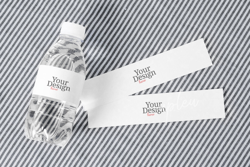 water-bottle-wrapper-mockup-water-bottle-with-stiped-tablecloth-mocku