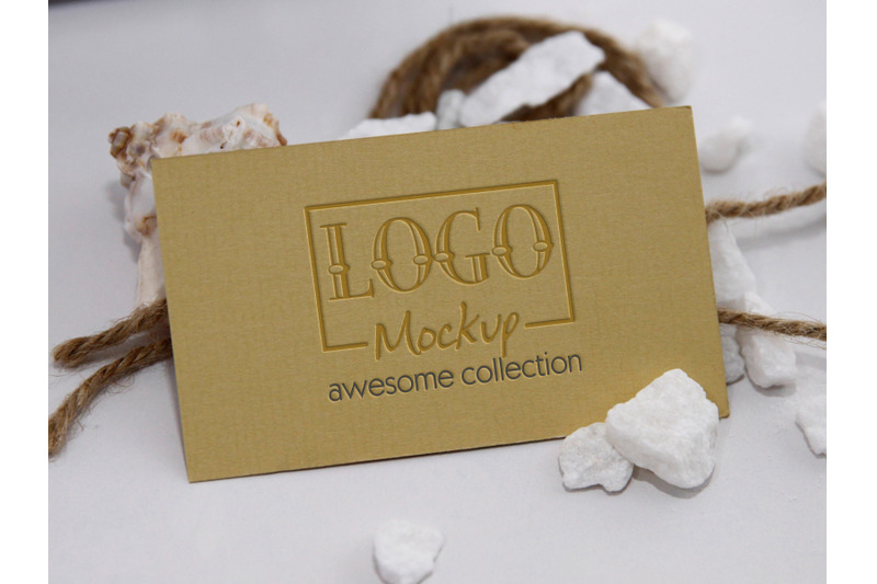 logo-mockup-with-white-stones-and-seashels-design