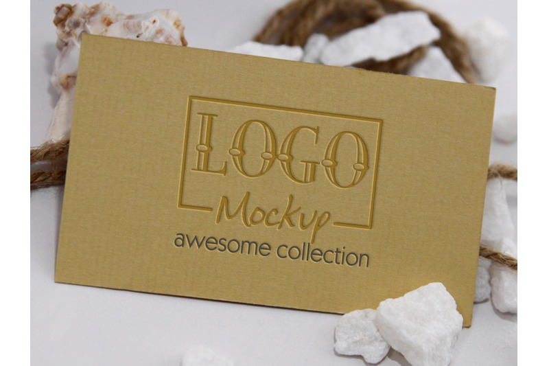 logo-mockup-with-white-stones-and-seashels-design