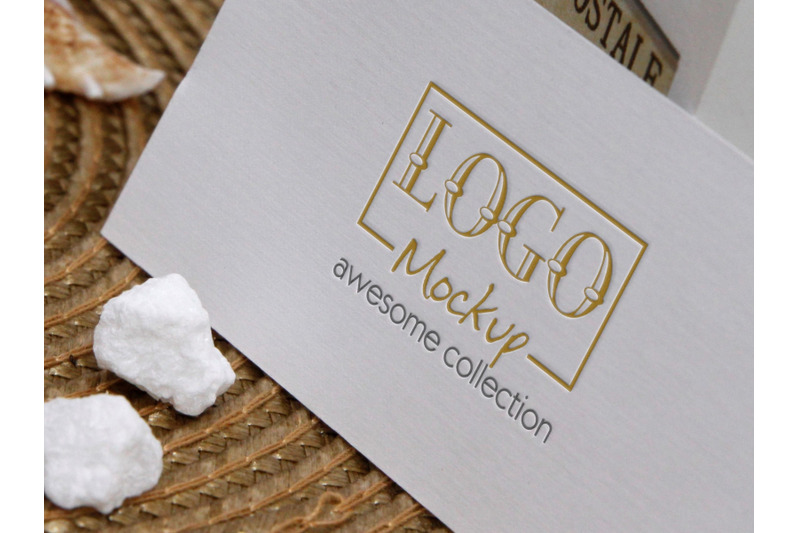 logo-mockup-on-white-stones-and-seashels