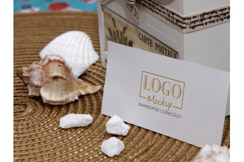 logo-mockup-on-white-stones-and-seashels