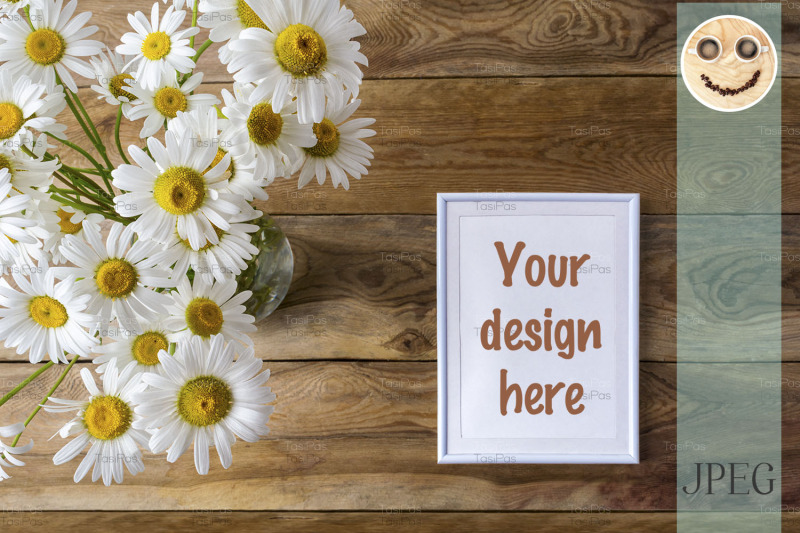 white-small-frame-mockup-with-daisy-wildflowers
