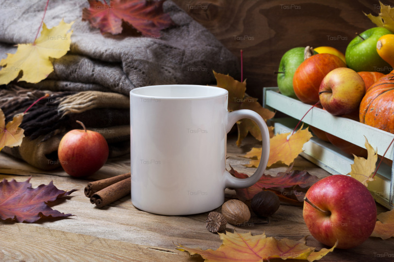 white-coffee-mug-mockup-with-fall-leaves-and-knitted-plaid