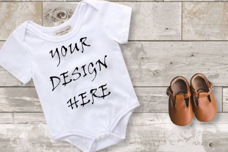 mockup-baby-boy-white-bodysuit-digital-mockups-wood-background-jpeg