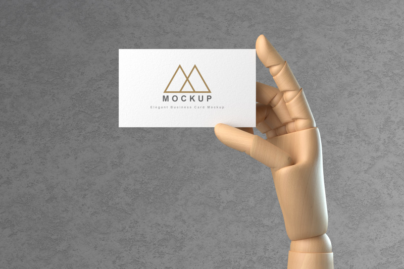 wooden-hand-holding-business-card-mockup