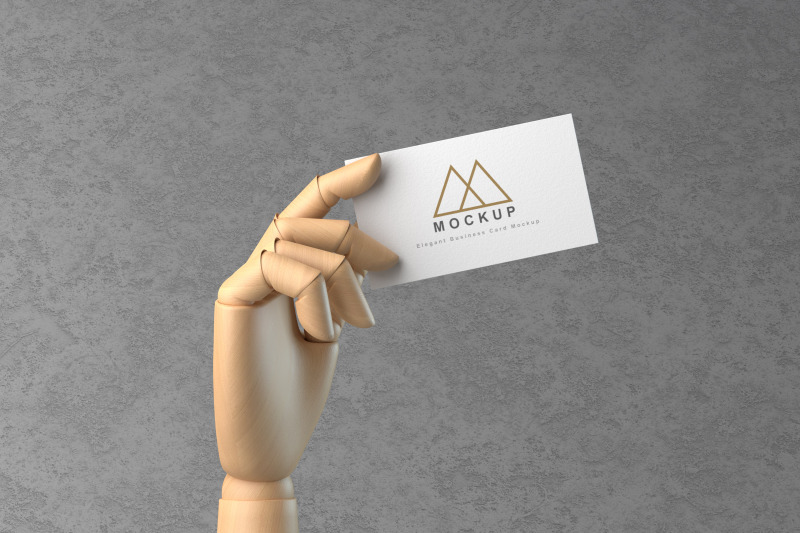 wooden-hand-holding-business-card-mockup