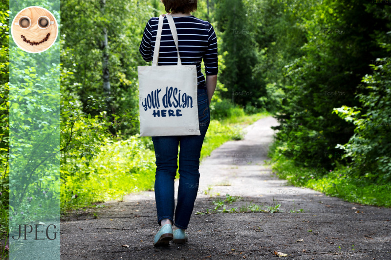 woman-in-striped-t-shirt-holding-tote-bag-mockup