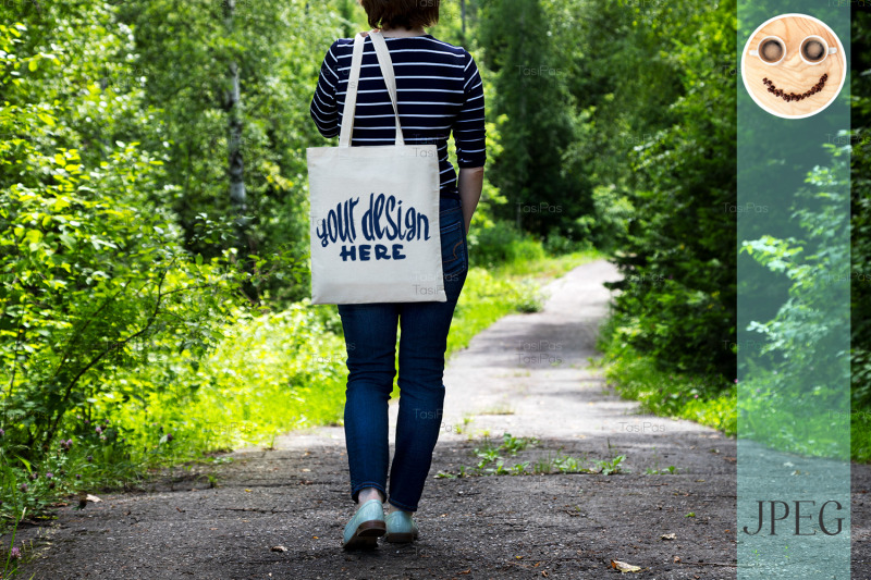 woman-in-striped-t-shirt-holding-tote-bag-mockup