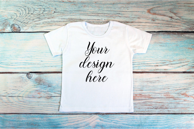 kids-white-t-shirt-mockup-on-a-wooden-background