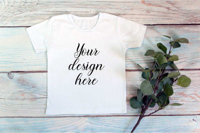 kids-white-t-shirt-mockup-on-a-wooden-background