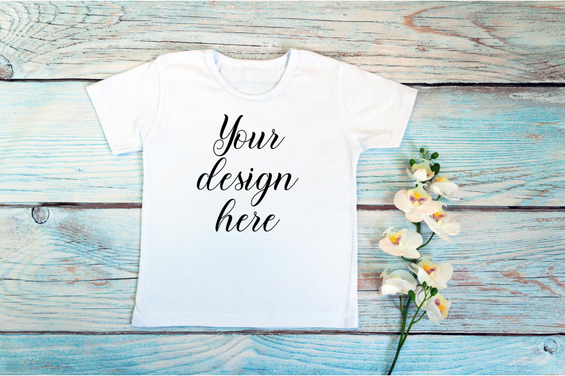 kids-white-t-shirt-mockup-on-a-wooden-background