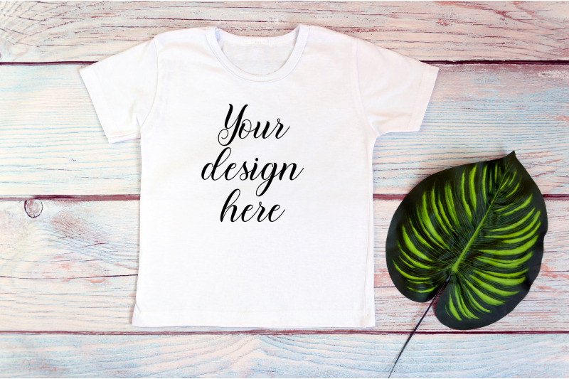 kids-white-t-shirt-mockup-on-a-wooden-background