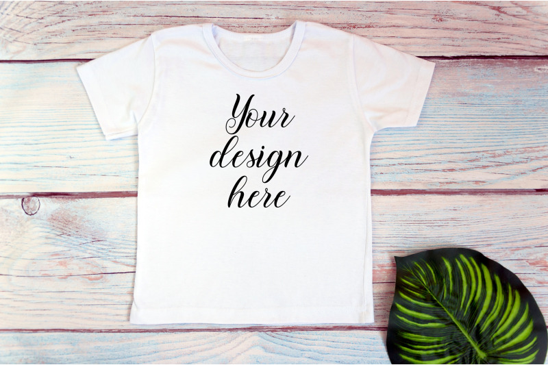 kids-white-t-shirt-mockup-on-a-wooden-background