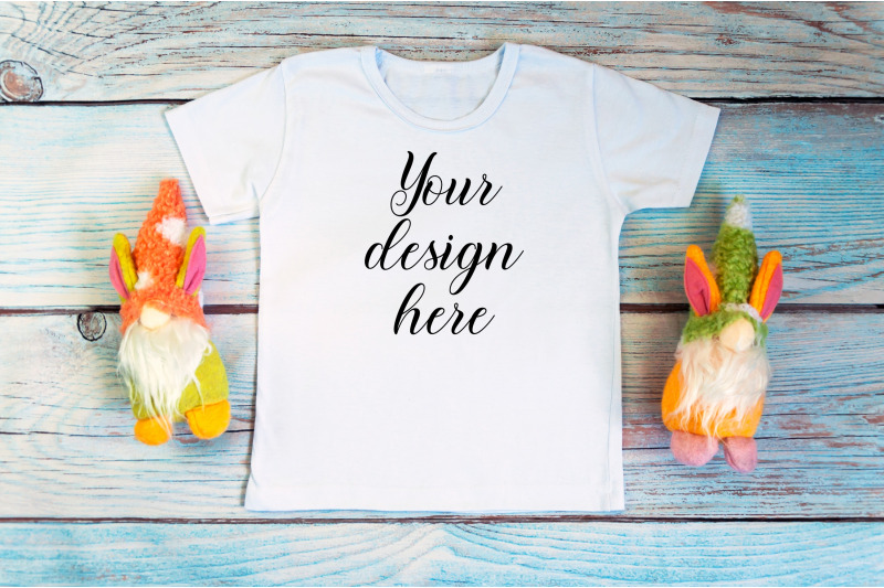 kids-white-t-shirt-mockup-with-gnomes-on-a-wooden-background