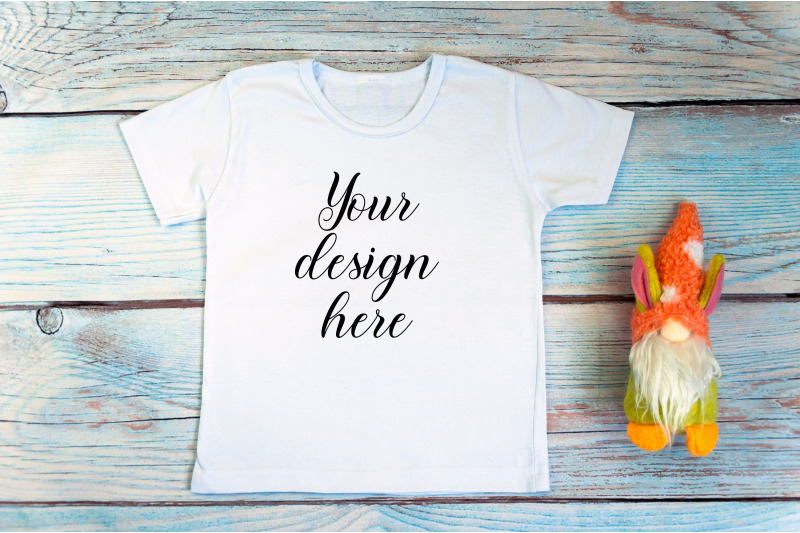 kids-white-t-shirt-mockup-with-gnomes-on-a-wooden-background