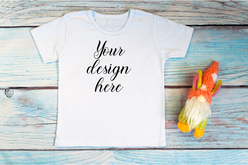 kids-white-t-shirt-mockup-with-gnomes-on-a-wooden-background