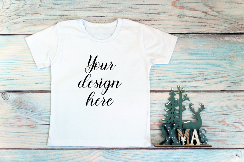 kids-christmas-white-t-shirt-mockup-on-a-wooden-background