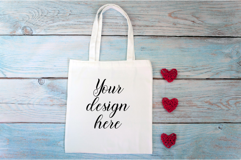 valentines-day-white-tote-bag-mockup-on-a-wooden-background
